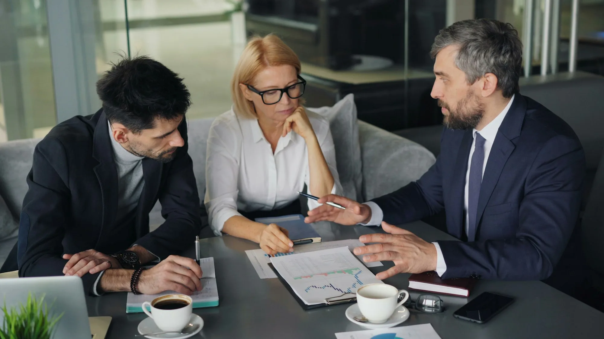 Agency team reviewing strategy around a table